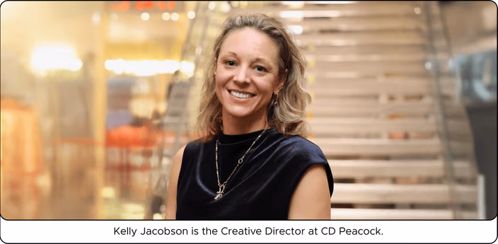Kelly Jacobson, Jewelry Creative Director at CD Peacock, smiling in the showroom