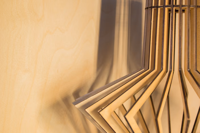 Close-up detail of stacked Shapelamp designs showing the precision ribbed construction and variety of forms