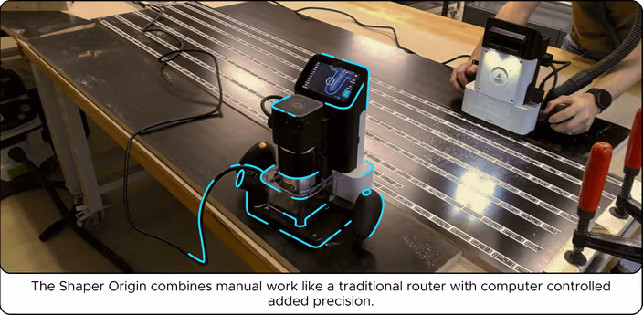 Shaper Origin handheld CNC router in use, combining manual control with computer-guided precision for cutting wooden parts