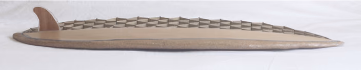 Cardboard prototype of a custom surfboard from digital fabrication research