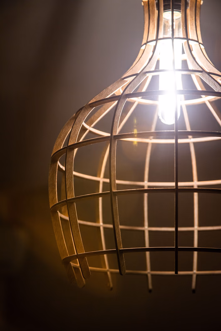 Close-up of an illuminated Shapelamp showing the beautiful geometric shadow patterns cast by its ribbed structure