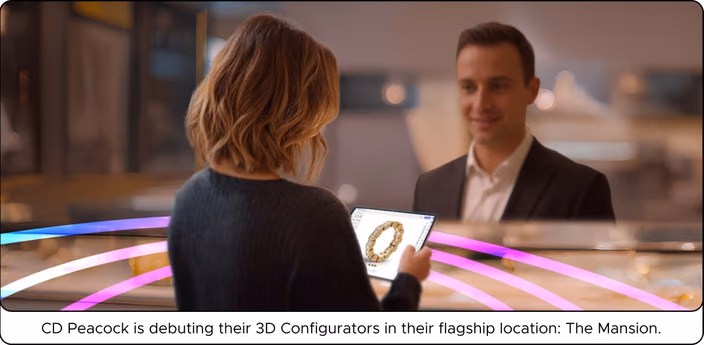 Customer exploring ring designs on a tablet with 3D configurator interface assisted by a designer in CD Peacock’s flagship Mansion showroom
